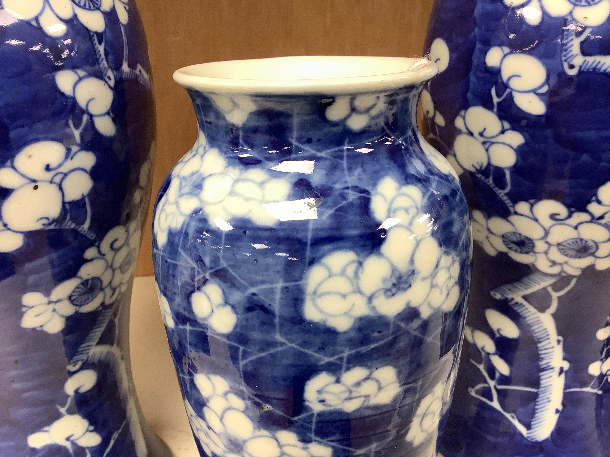 A pair of late 19th century Chinese prunus blossom baluster vases, 30cm, and a Japanese ovoid vase